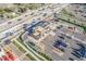 Overhead view of modern retail building and surrounding landscape, ample parking, and visible thoroughfare at 7801 W 35Th Ave # 406, Wheat Ridge, CO 80033