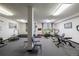Bright gym with multiple fitness machines and equipment plus large windows at 7801 W 35Th Ave # 406, Wheat Ridge, CO 80033