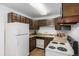 Functional kitchen with ample cabinet space, essential appliances, and convenient layout for meal preparation at 7801 W 35Th Ave # 406, Wheat Ridge, CO 80033