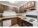 Efficient kitchen featuring ample storage, practical appliances, and a clean, functional workspace at 7801 W 35Th Ave # 406, Wheat Ridge, CO 80033