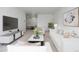Open living room with stylish furniture, modern decor, and seamless flow into the dining area at 7801 W 35Th Ave # 406, Wheat Ridge, CO 80033