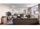 Spacious living room featuring neutral tones, plush sofas, and large windows for natural light at 7801 W 35Th Ave # 406, Wheat Ridge, CO 80033