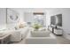 Bright living room featuring neutral tones, a large arched window, and comfortable seating arrangement at 7801 W 35Th Ave # 406, Wheat Ridge, CO 80033