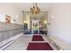 Well-lit lobby area with a bench, mailboxes, and glass entry doors at 7801 W 35Th Ave # 406, Wheat Ridge, CO 80033