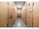 Long hallway with storage units in an indoor storage area with numbered doors at 7801 W 35Th Ave # 406, Wheat Ridge, CO 80033