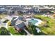 Aerial view of community clubhouse and pool surrounded by well-maintained grounds at 9756 Ash Ln, Thornton, CO 80229