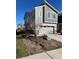 Two-story home featuring a two-car garage and professionally landscaped front yard at 9756 Ash Ln, Thornton, CO 80229