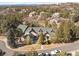 Stunning aerial view of a home nestled within a lush, green landscape and mountain views at 7115 Parkwood Ln, Castle Pines, CO 80108