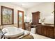 Luxurious bathroom featuring a soaking tub, vanity, and natural lighting at 7115 Parkwood Ln, Castle Pines, CO 80108