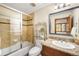 Bathroom featuring a single sink, shower, tub, toilet, and mirror at 7115 Parkwood Ln, Castle Pines, CO 80108