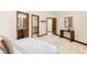 Comfortable bedroom with closet, bathroom doorway entrances and decor at 7115 Parkwood Ln, Castle Pines, CO 80108