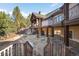 Expansive backyard patio of large home perfect for entertaining and enjoying the outdoors at 7115 Parkwood Ln, Castle Pines, CO 80108