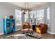 Cozy living room featuring a large window and comfortable leather chairs at 2879 Hilltop Ct, Broomfield, CO 80023