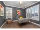 Well-lit home office with plantation shutters, stylish decor, and hardwood floors at 2879 Hilltop Ct, Broomfield, CO 80023