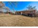Brick home with large backyard, beautiful mountain views, and mature trees at 2813 S Ivan Way, Denver, CO 80227