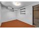 Finished basement with shelving and orange carpeting at 2813 S Ivan Way, Denver, CO 80227