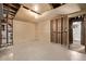 Unfinished basement with walkout door and visible framing at 2813 S Ivan Way, Denver, CO 80227