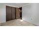Unfinished basement featuring concrete floor and walk out door at 2813 S Ivan Way, Denver, CO 80227
