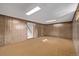 Partially finished basement with carpet, panelling and drop ceiling at 2813 S Ivan Way, Denver, CO 80227