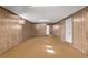 Partially finished basement with carpet and panelling at 2813 S Ivan Way, Denver, CO 80227