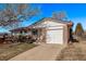 Charming single-Gathering home with a brick facade, attached garage, and a well-maintained front yard at 2813 S Ivan Way, Denver, CO 80227