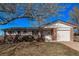 Charming single-Gathering home with a brick facade, attached garage, and a well-maintained front yard at 2813 S Ivan Way, Denver, CO 80227