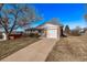 Charming single-Gathering home with a brick facade, attached garage, and a well-maintained front yard at 2813 S Ivan Way, Denver, CO 80227