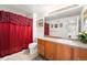 Bathroom vanity featuring ample cabinet storage space, neutral countertop and a shower tub combo at 5534 Lewis St # 202, Arvada, CO 80002