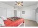 Bedroom featuring closet and a ceiling fan at 5534 Lewis St # 202, Arvada, CO 80002