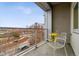 Private balcony with city views and seating area at 2958 Syracuse St # 303, Denver, CO 80238