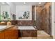 Spa-like bathroom with soaking tub, walk-in shower, and modern vanity at 2958 Syracuse St # 303, Denver, CO 80238