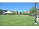 Large grassy area with modern buildings in background at 2958 Syracuse St # 303, Denver, CO 80238