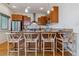 Modern kitchen island with seating for four at 2958 Syracuse St # 303, Denver, CO 80238