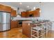 Modern kitchen with wood cabinets and granite countertops at 2958 Syracuse St # 303, Denver, CO 80238