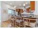 Modern kitchen island with seating for four at 2958 Syracuse St # 303, Denver, CO 80238