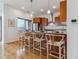 Modern kitchen island with seating for four at 2958 Syracuse St # 303, Denver, CO 80238