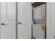 Stackable washer and dryer in a closet at 2958 Syracuse St # 303, Denver, CO 80238