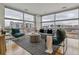 Spacious living room featuring floor-to-ceiling windows offering ample natural light at 2958 Syracuse St # 303, Denver, CO 80238