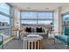 Bright living room with floor to ceiling windows at 2958 Syracuse St # 303, Denver, CO 80238