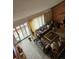 Open living room featuring large windows, neutral carpet, and comfortable seating at 4484 Juniper Ct, Larkspur, CO 80118
