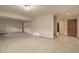Spacious carpeted basement area with neutral walls and trim, offering versatile living space and potential for customization at 70 Long Bow Cir, Monument, CO 80132