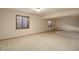 Basement area with carpet and large windows offers a versatile living space at 70 Long Bow Cir, Monument, CO 80132