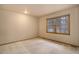 Bedroom features neutral walls, carpet flooring, and a window view of the outside at 70 Long Bow Cir, Monument, CO 80132