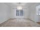 Open dining room with a modern chandelier and large window with natural light at 70 Long Bow Cir, Monument, CO 80132