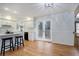 Bright kitchen featuring white cabinets, marble countertops, stainless appliances, and backyard access at 70 Long Bow Cir, Monument, CO 80132