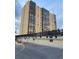 Modern high-rise condominium featuring multiple floors of units with large windows and secure resident access at 7865 E Mississippi Ave # 706, Denver, CO 80247