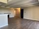 Bright living room featuring hardwood floors, neutral walls, and a cozy stone fireplace at 7865 E Mississippi Ave # 706, Denver, CO 80247