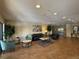 Lobby area with ample seating, plants, contemporary art, and elevator access at 7865 E Mississippi Ave # 706, Denver, CO 80247