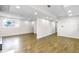 Spacious basement featuring laminate flooring and abundant natural light from the window at 220 S Raleigh St, Denver, CO 80219