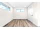 Comfortable bedroom with hardwood floors, large windows, and a closet at 220 S Raleigh St, Denver, CO 80219